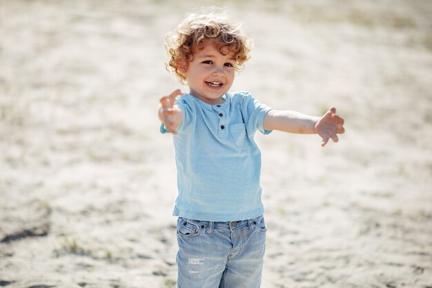 Cute little children playing on a sand