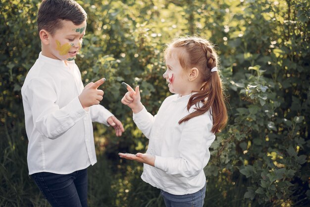 Cute little children in a spring field