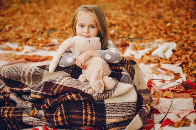 Cute little girl in a autumn park