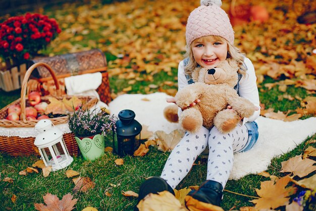 Cute little girl in a autumn park