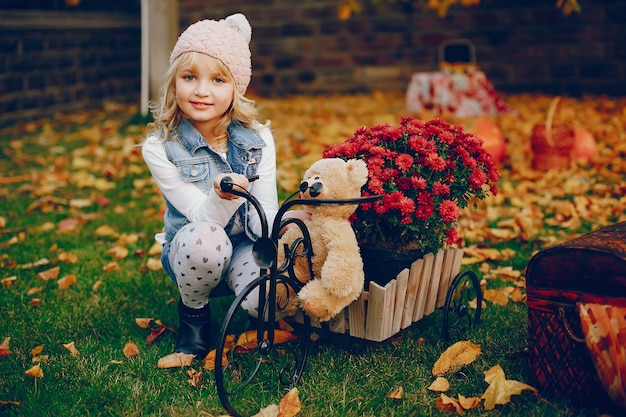 Cute little girl in a autumn park