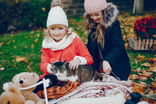 Free photo cute little girl in a autumn park