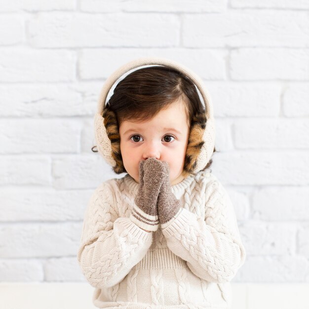 Cute little girl covering her face