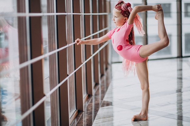 Cute little girl doing gymnastics