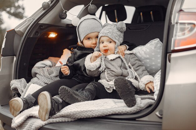 cute little girl playing in a park with her sister