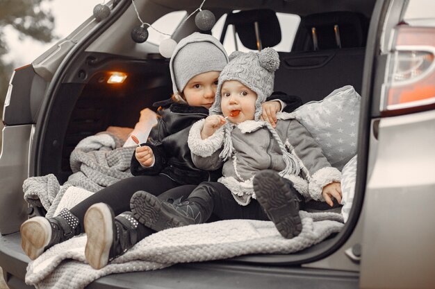 Cute little girl playing in a park with her sister