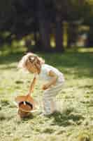 Free photo cute little girl playing in a summer park