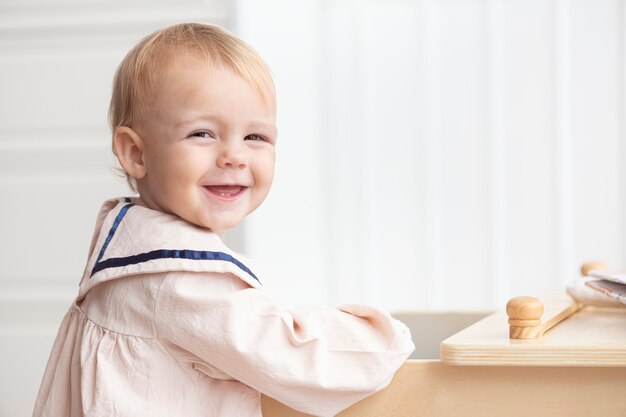 Cute little girl in a sailor dress