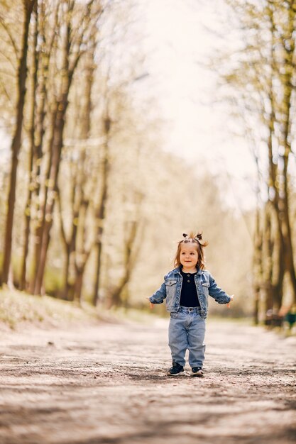 Cute little girl in a spring park