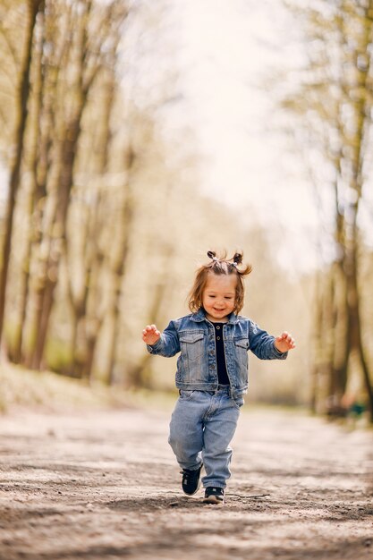 Cute little girl in a spring park