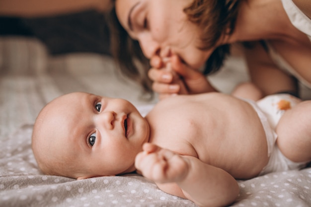 Cute little newborn baby boy with mom