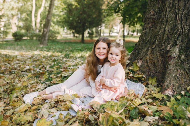 Cute little sisters playing  in a spring park