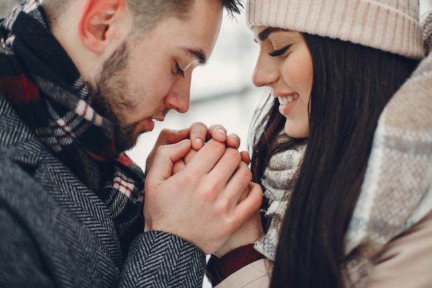 Cute and loving couple in a winter city