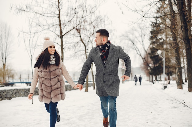 Cute and loving couple in a winter city