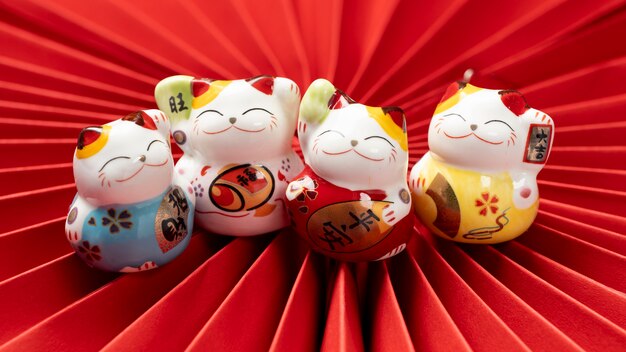 Cute lucky cats with red paper high angle