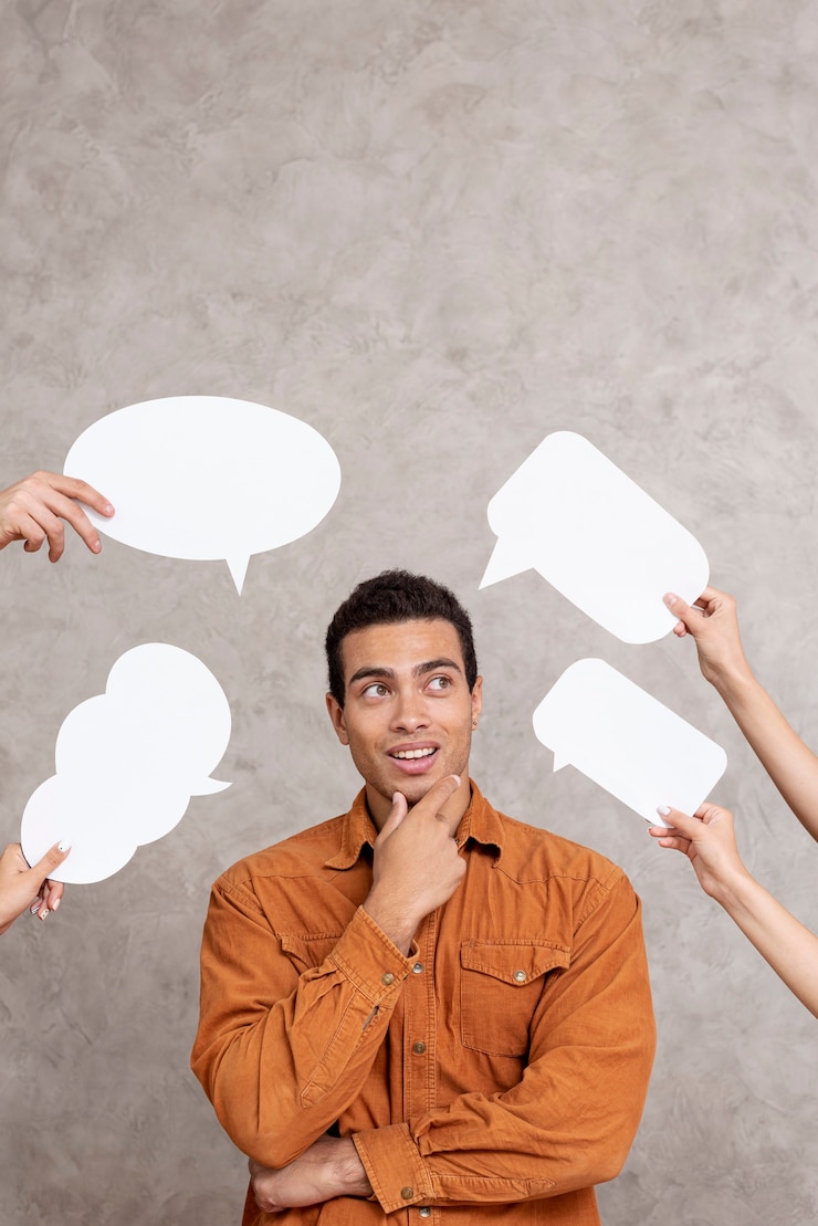 Free Photo cute man surrounded by speech bubbles