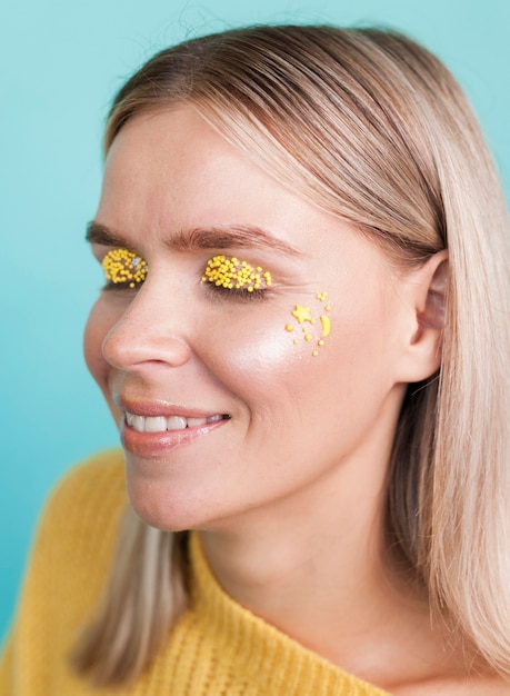 Free photo cute model wearing yellow eyeshadow