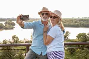 Free photo cute old couple taking a selfie