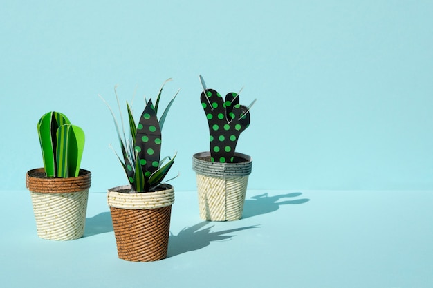 Free photo cute paper cut style of artificial cacti