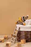 Free photo cute plush toy and ladder arrangement