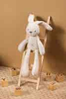 Free photo cute plush toy and ladder arrangement