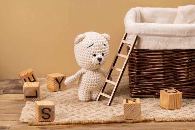 Free photo cute plush toy and ladder arrangement