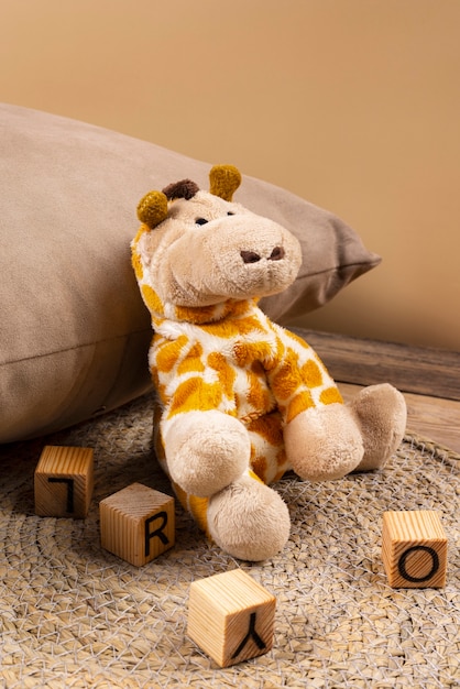 Free photo cute plush toy and pillow arrangement