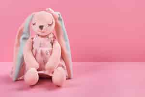 Free photo cute plush toy with pink background