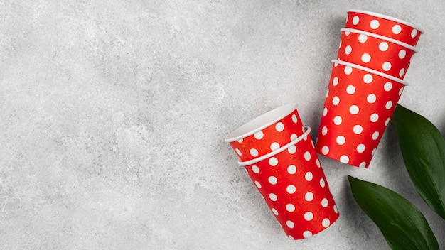 Cute red with white dots cups and plant