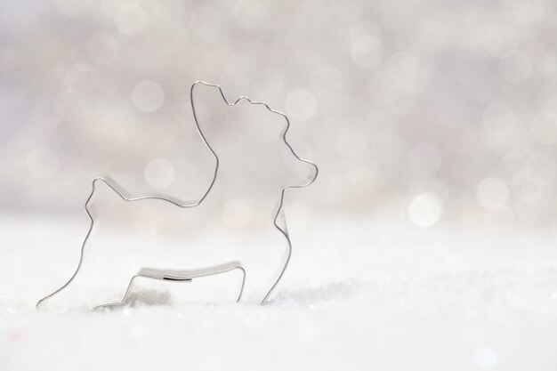 Cute reindeer figure as a Christmas decoration on a blurred background