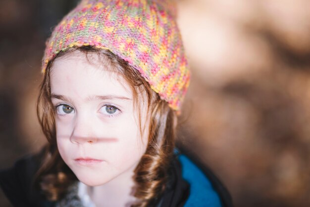 Cute sad girl in hat