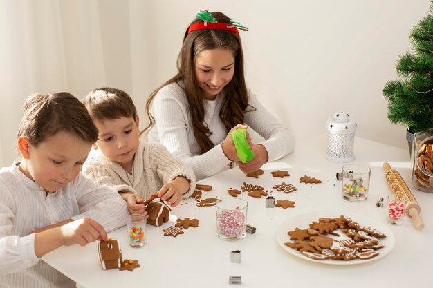 Cute siblings celebrating christmas together