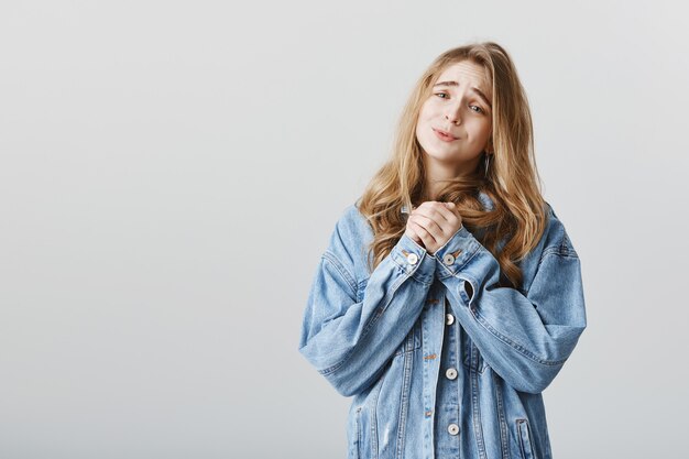 Cute silly blond girl looking at something adorable