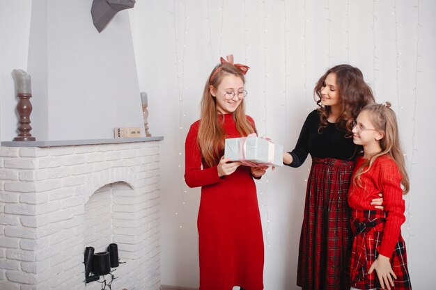 Cute sisters in a cute dress at home