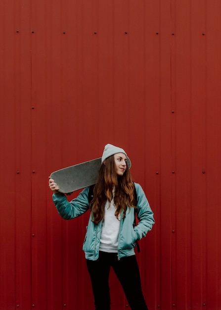 Cute skater girl and her skateboard