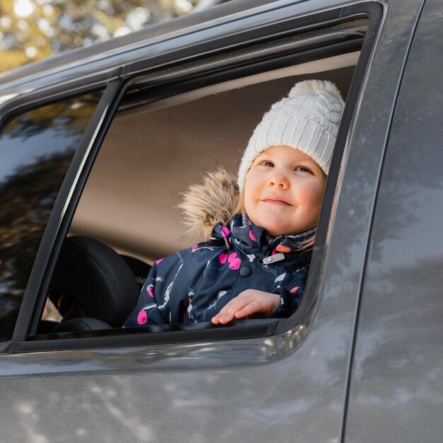 Cute smiley girl in car