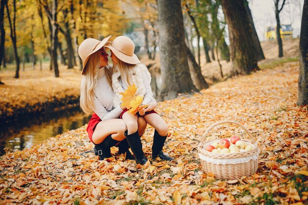 Cute and stylish family in a autumn park