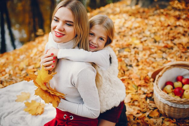 Cute and stylish family in a autumn park