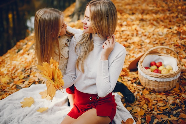 Free photo cute and stylish family in a autumn park