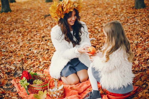 Cute and stylish family in a autumn park