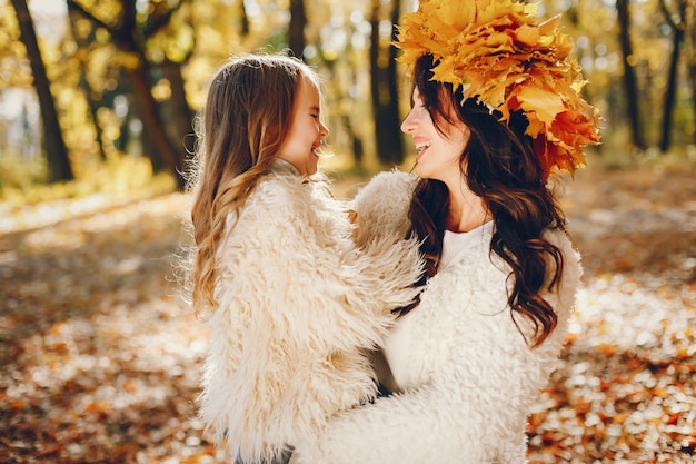 Cute and stylish family in a autumn park