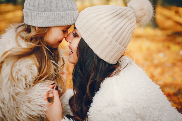 Cute and stylish family in a autumn park