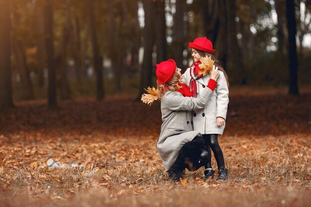 Cute and stylish family in a autumn park