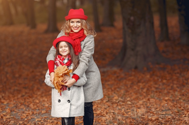 Cute and stylish family in a autumn park