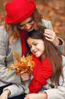 Free photo cute and stylish family in a autumn park