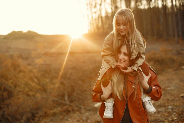 Cute and stylish family in a autumn park