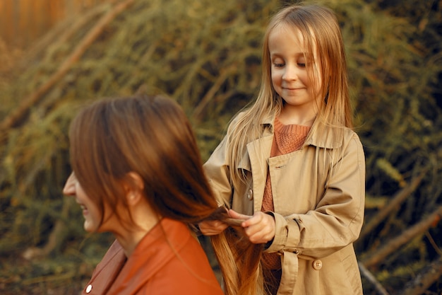 Cute and stylish family in a autumn park