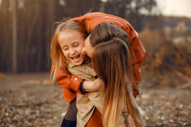 Cute and stylish family in a autumn park