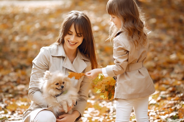 Cute and stylish family in a autumn park