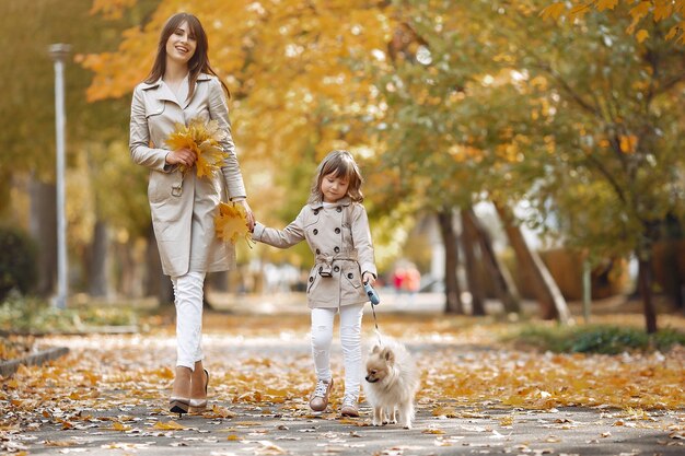 Cute and stylish family in a autumn park